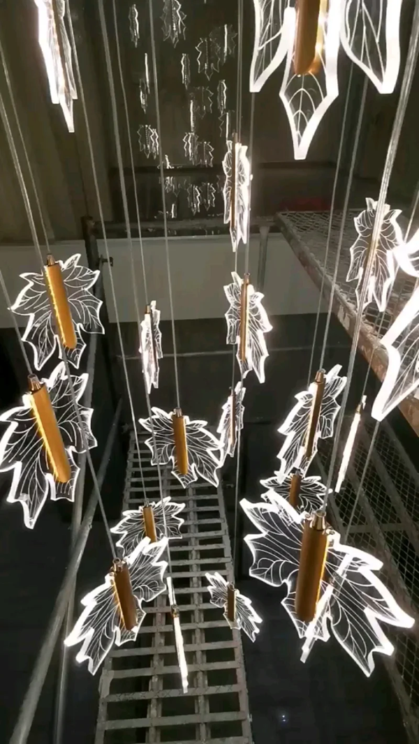 Contemporary Drummondii LED Staircase Chandelier by Lights of Scandinavia, inspired by the elegance of maple leaves, ideal for duplex building halls. Combines Nordic artistry with modern design and advanced LED technology to create an inviting ambiance.