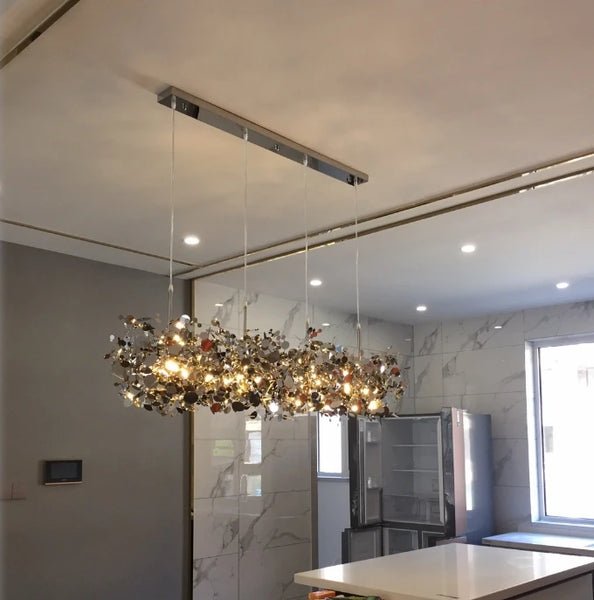 High-quality stainless steel Aurora chandelier with G9 light sources, available in Golden and Chrome finishes. Perfect for living rooms, dining rooms, bedrooms, villas, and lobbies, this versatile design blends luxury and functionality for a brilliant and inviting ambiance.